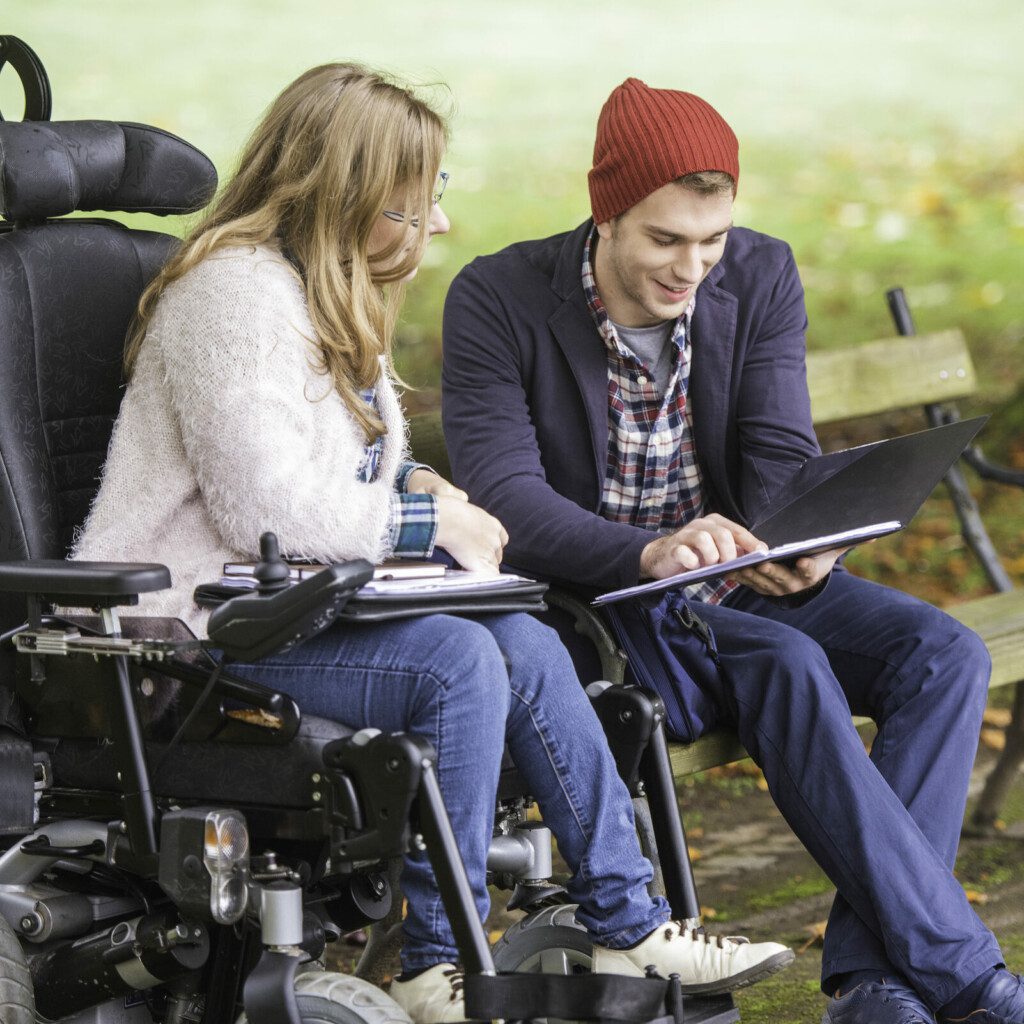 Student helping friend with disability