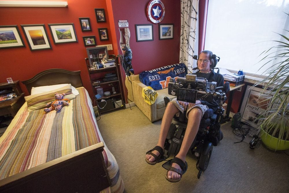 Steve Saling sits in his bedroom at the Leonard Florence Center For Living in Chelsea.